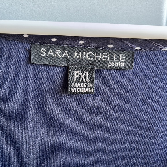 Brand NWT. Navy/ White dot tie sleeve bubble hem blouse. Brand: Sara Michelle - Picture 2 of 5